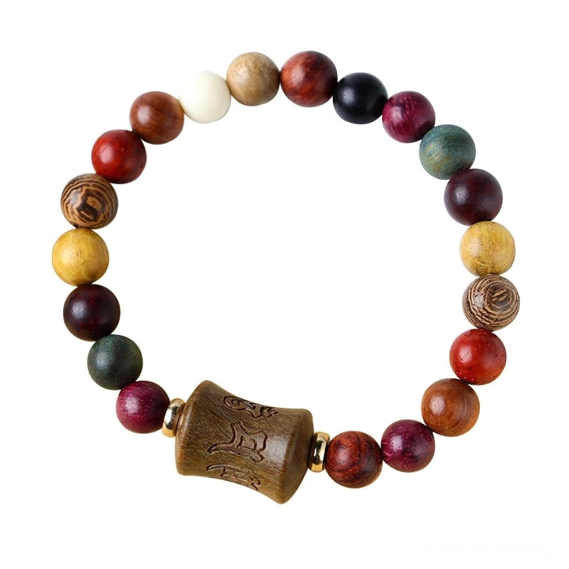 Handcrafted Tibetan sandalwood protection bracelet showing natural wood color variations and authentic artisanal craftsmanship details