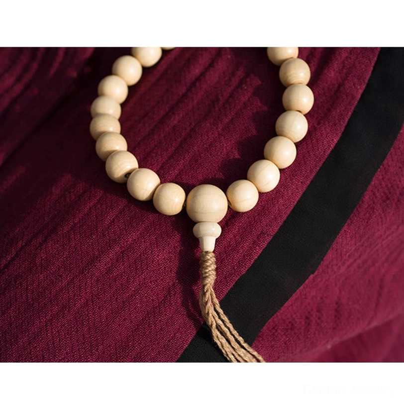 Artisan crafted Abelia Biflora wooden mala beads displaying handmade quality, natural variations, and authentic Tibetan Buddhist spiritual craftsmanship