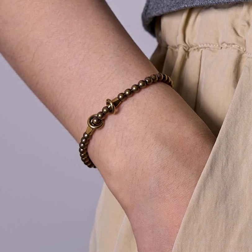Handmade antique bronze brass beads bracelet showing natural variations and authentic craftsmanship details