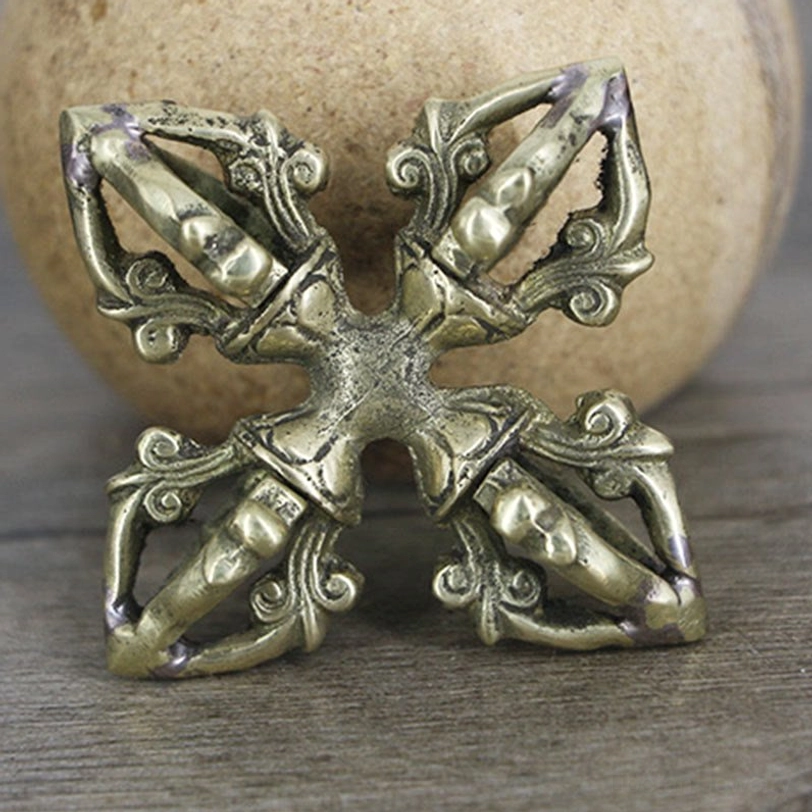 Handmade copper dorje vajra for meditation and Buddhist practice, displaying traditional 5-prong cross symbolism and artisan craftsmanship