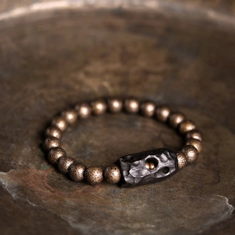 Handmade ebony wood copper beaded bracelet complete circle overhead showing all beads and spacer