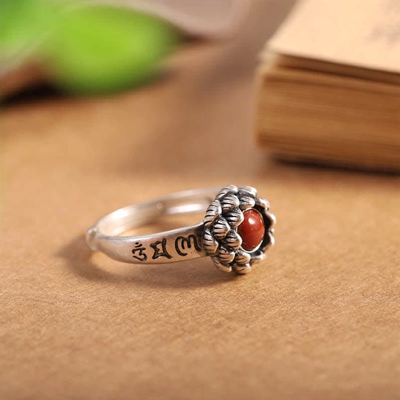Artisan-crafted sterling silver lotus red agate ring, back lotus detail on book
