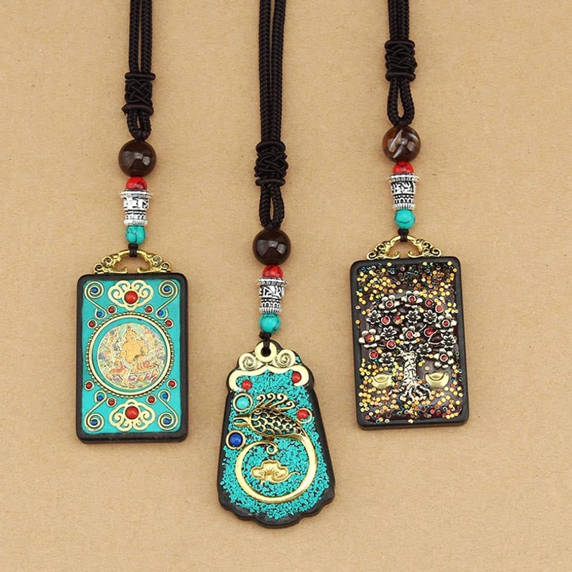 Handcrafted Tibetan Five Gods of Wealth thangka pendant necklace showcasing artisan quality, natural materials, and spiritual authenticity