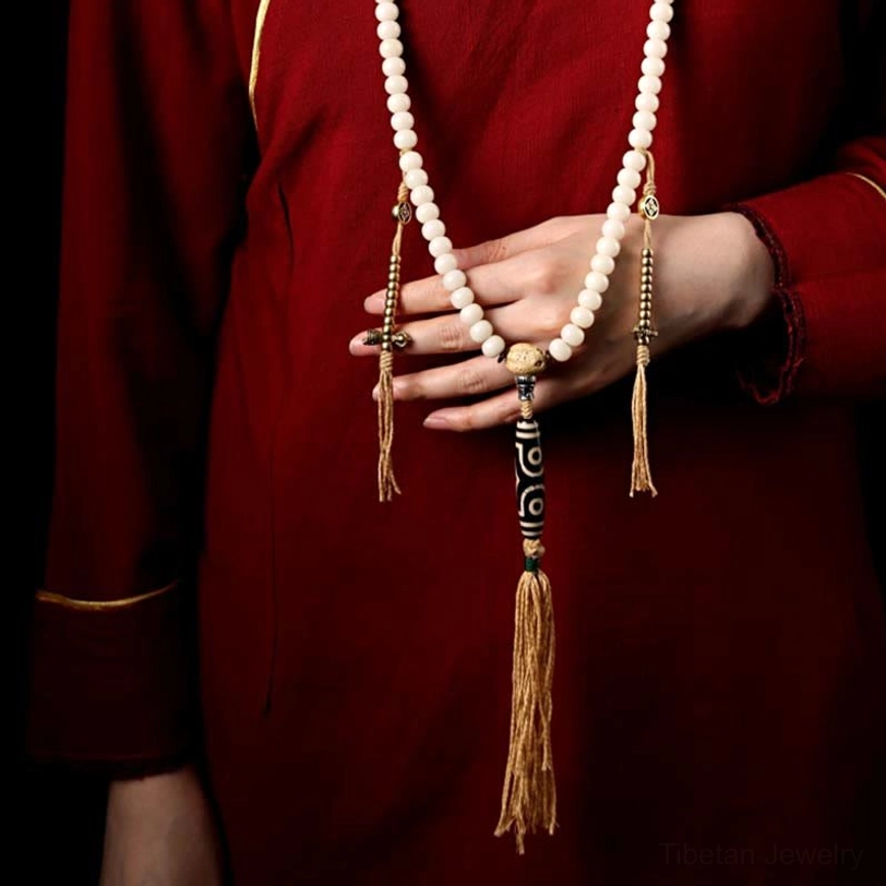 Handmade tibetan mala beads with nine-eye dzi bead and sacred geometry silver ornaments