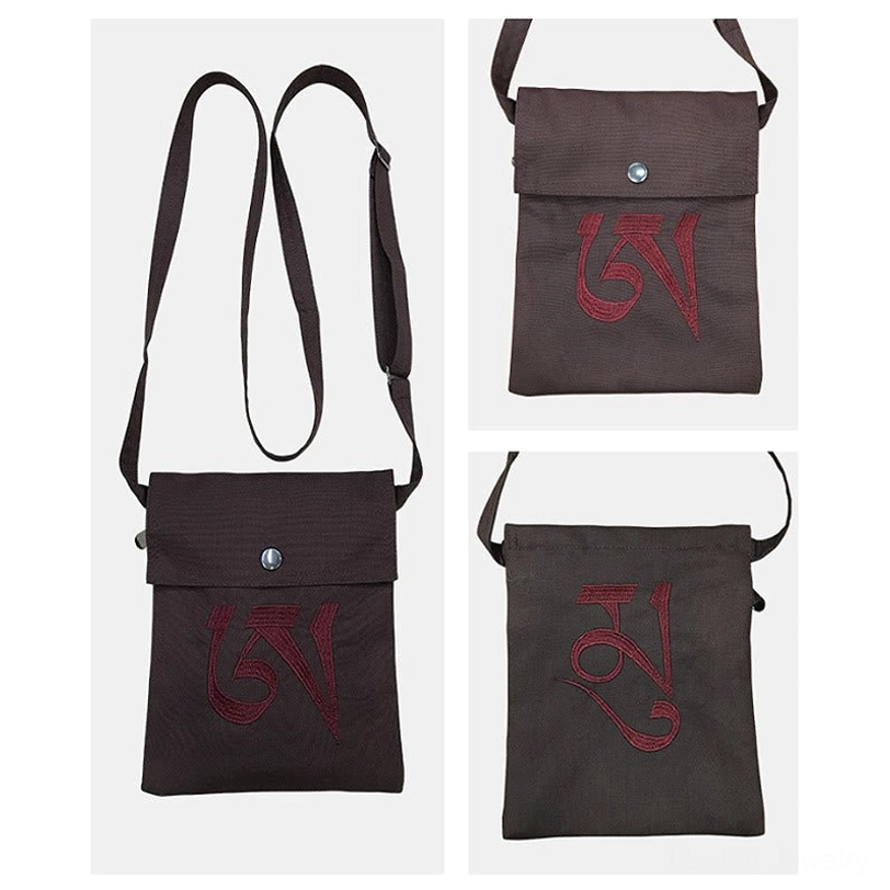 Handmade Tibetan OM crossbody bag showcasing traditional Buddhist mantra embroidery and eco-friendly cotton canvas construction
