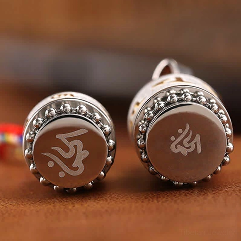 Handmade Tibetan prayer wheel pendant showcasing authentic Buddhist spiritual craftsmanship