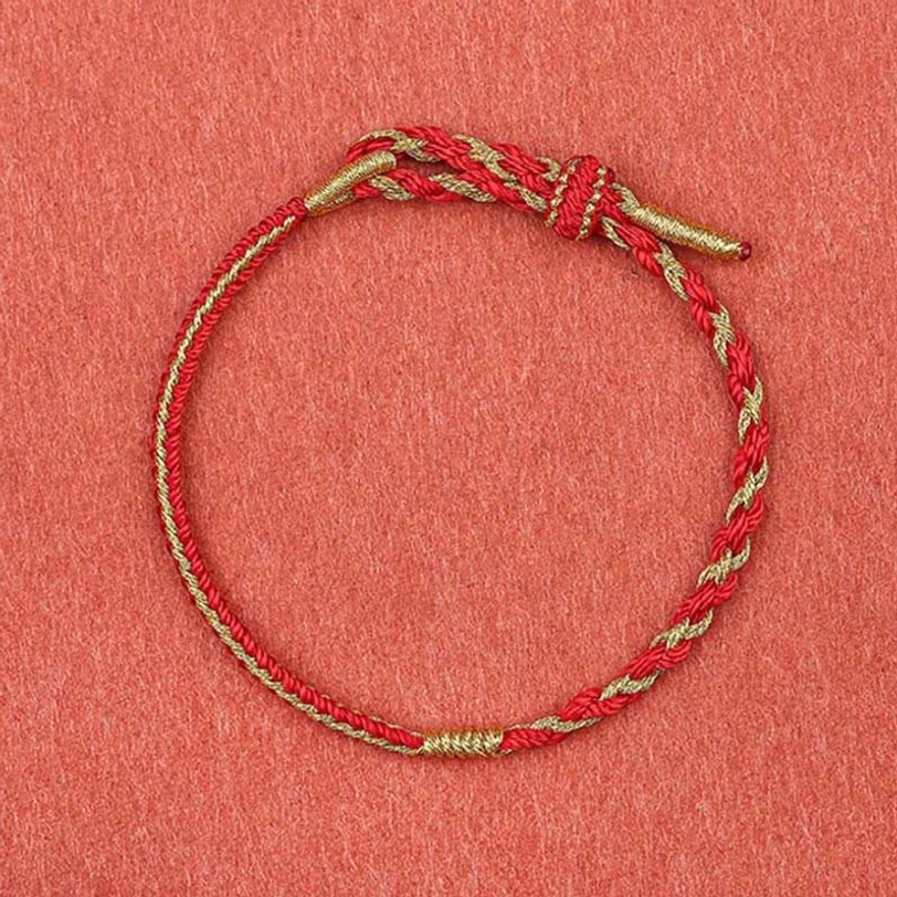 Tibetan protection bracelet in red and gold braided design with adjustable fit