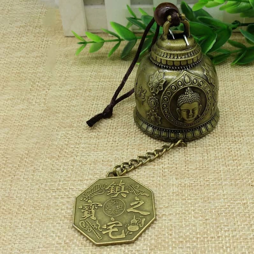 Artisan handmade Tibetan wind chime showcasing traditional craftsmanship with embossed Buddhist iconography