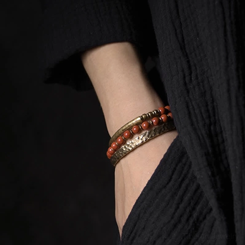 Engraved copper cuff paired with red stone beads healing bracelet - wrist wear detail