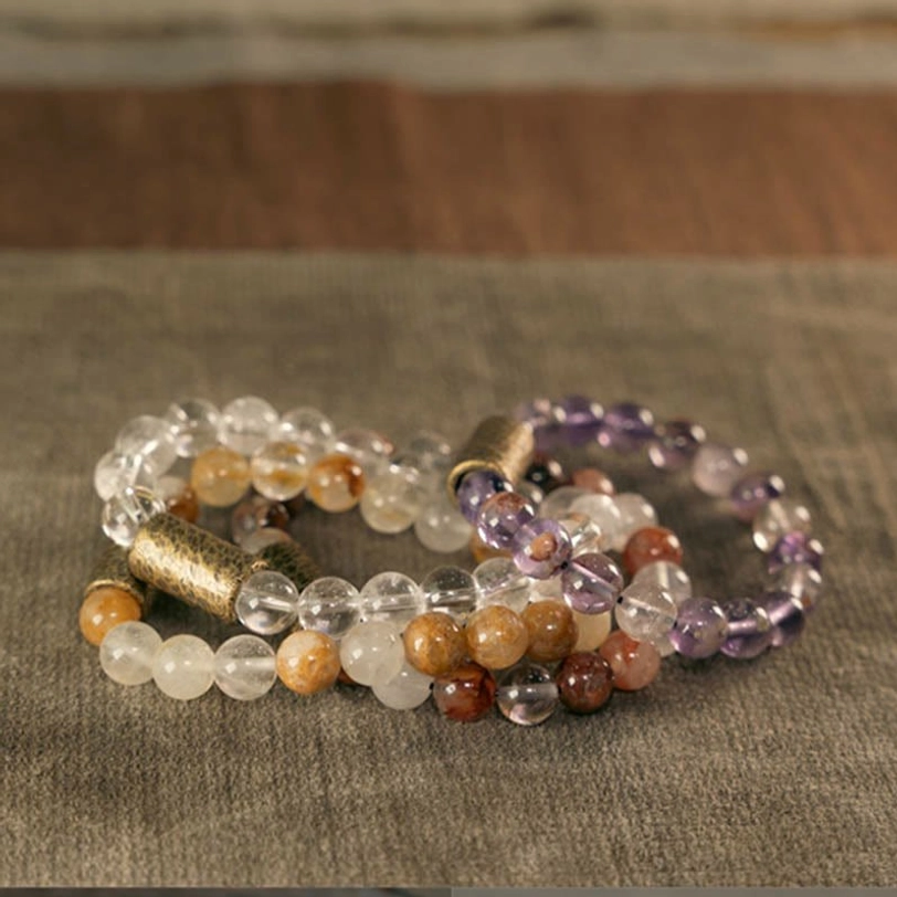 Premium natural gemstone materials used in healing crystal bracelet, raw stone sourcing detail