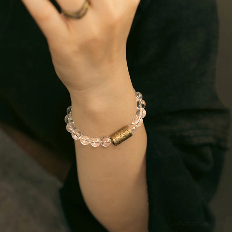 Close-up frontal view of spiritual crystal bracelet worn on right wrist showing daily wear comfort and elegance