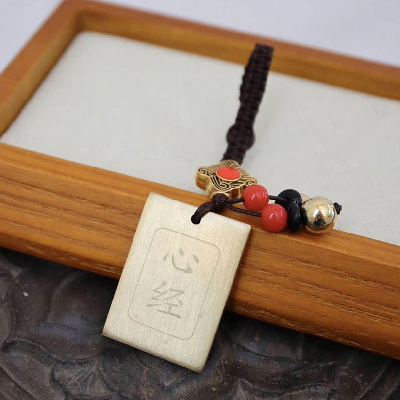 Heart Sutra brass tag keychain with engraved Buddhist wisdom mantra and decorative bead ornaments