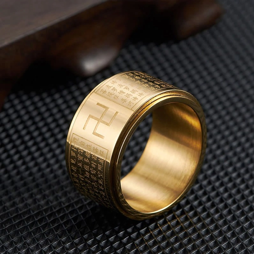 Gold Heart Sutra Swastika Ring top-down view showing engraved scriptures and rotatable band design