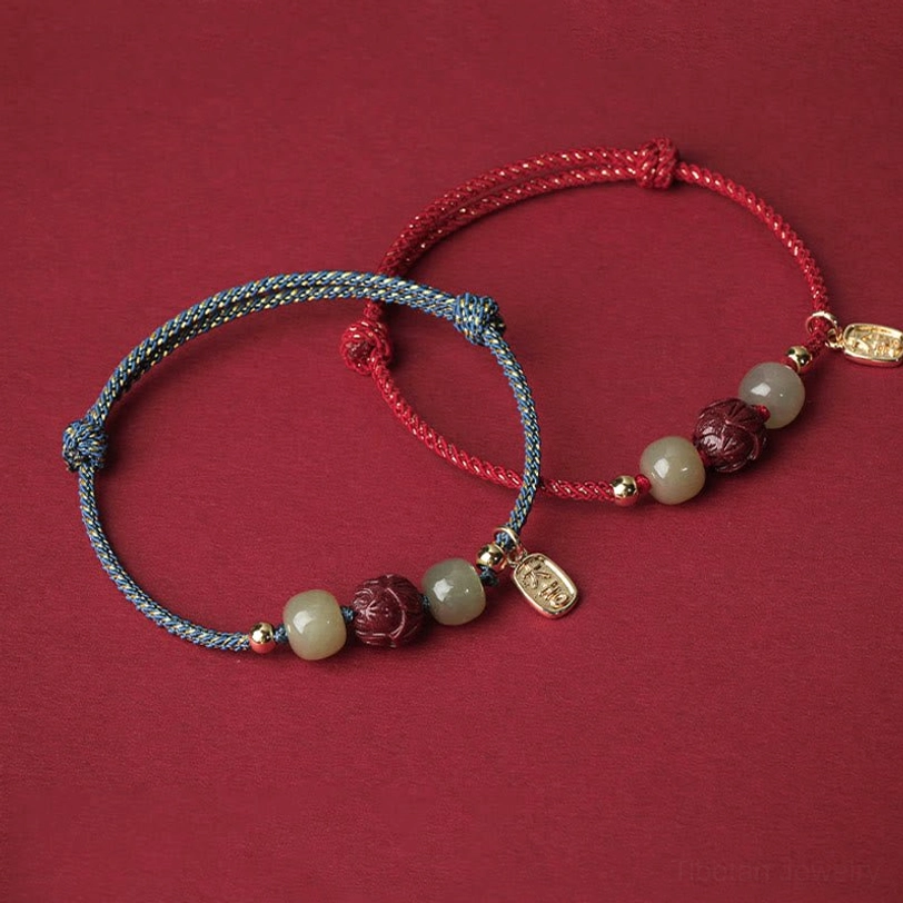 Natural Hetian jade beads showing authentic color variation and stone quality