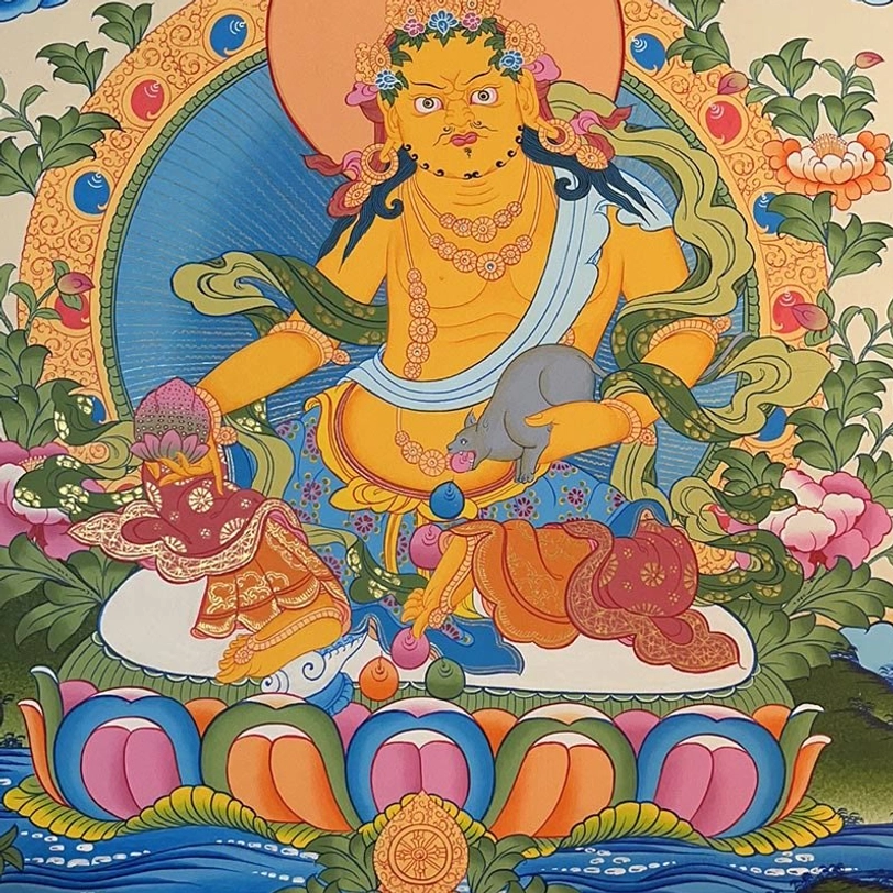 Yellow Jambhala God of Wealth thangka with elaborate jewelry and colorful lotus base decoration