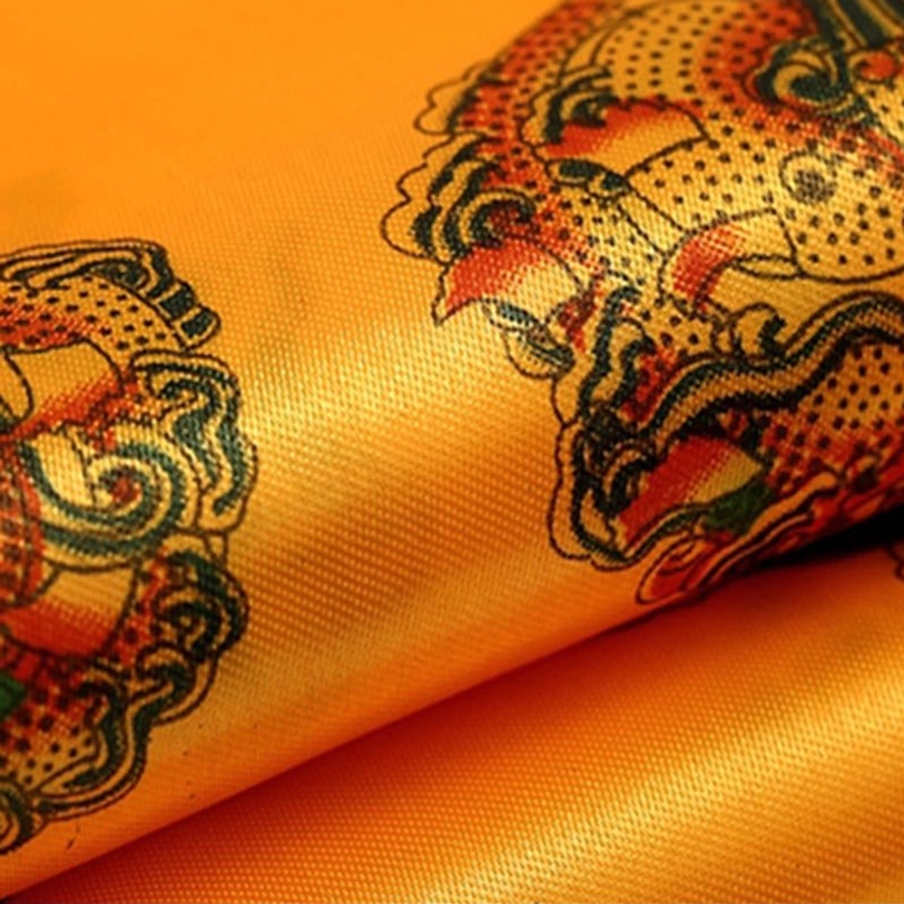 Tibetan khata ceremonial scarf gift presentation showing proper folding method with traditional auspicious symbols and tasseled edges