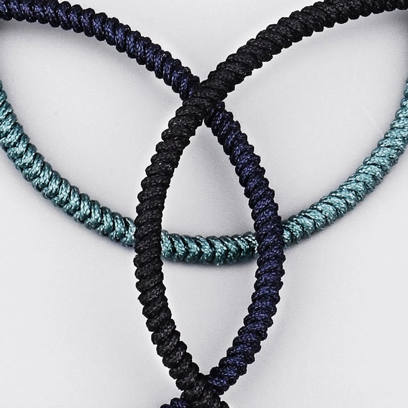King Kong knot protection bracelet close-up detail showing authentic handcrafted braided weave and natural string material