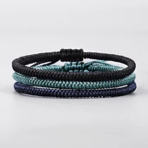 King Kong knot bracelets neatly arranged from top view showcasing braided rope texture and three color variants