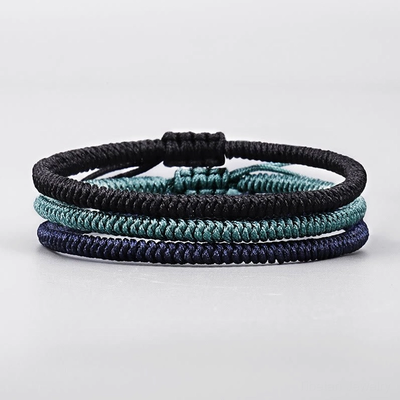 King Kong knot bracelets neatly arranged from top view showcasing braided rope texture and three color variants