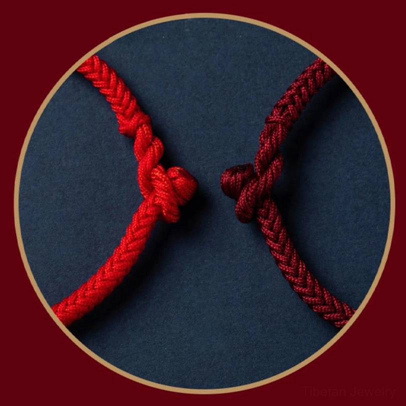Close-up detail of King Kong knot braided closure on Om Mani Padme Hum Tibetan bracelet in red and maroon