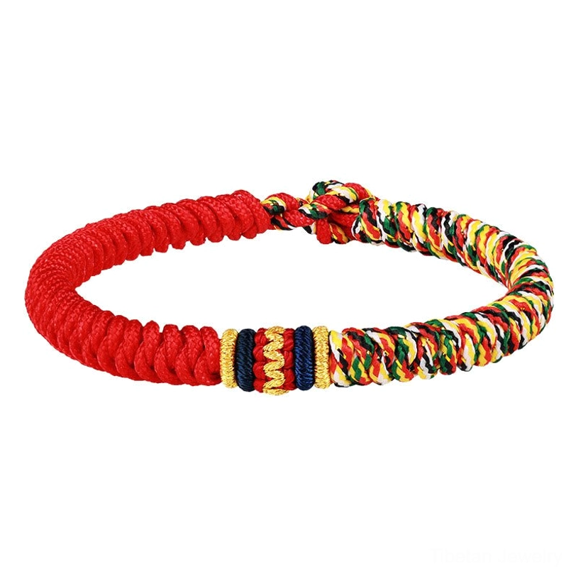 Red multicolored Tibetan braided bracelet with woven central sections on white background