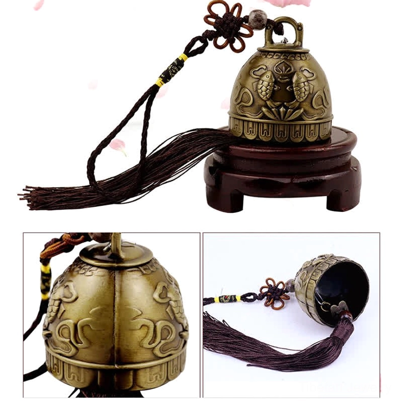 Double koi fish embossed wind chime bell in bronze tone with decorative patterns, handcrafted spiritual charm