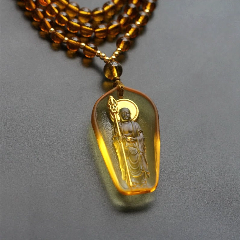 Handcrafted amber Liuli crystal Ksitigarbha Bodhisattva pendant with golden halo and brown beaded chain