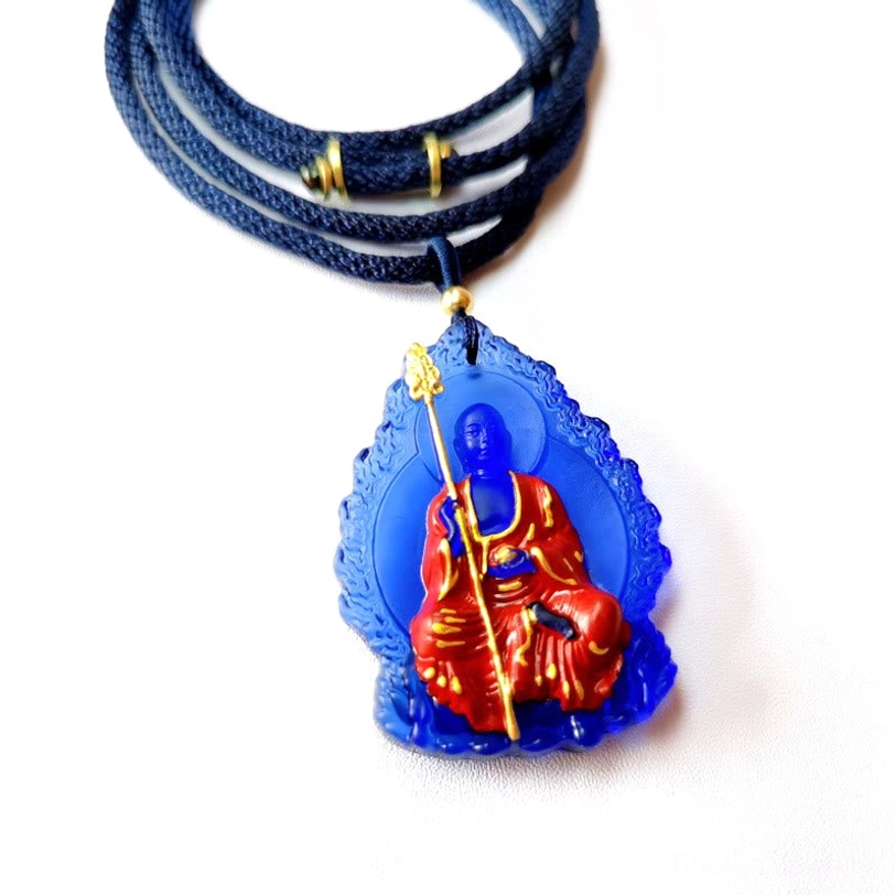 Sapphire blue Ksitigarbha Buddha Liuli crystal necklace with seated bodhisattva design and blue beaded chain