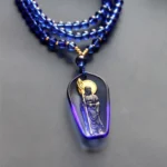 Ksitigarbha Bodhisattva Liuli crystal pendant necklace with gradient blue glass and golden halo monk staff detail