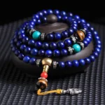 108-bead Lapis Lazuli Tibetan mala bracelet with tiger eye and turquoise gemstones overhead close-up view