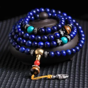 108-bead Lapis Lazuli Tibetan mala bracelet with tiger eye and turquoise gemstones overhead close-up view