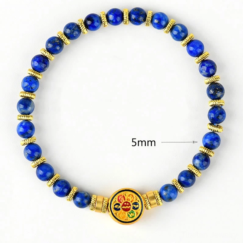 5mm lapis lazuli bead bracelet with gold hardware and Om Mani charm displayed on white background showing bead size