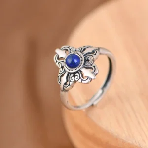 Adjustable lapis lazuli silver ring side view showing open band design and carved vintage details