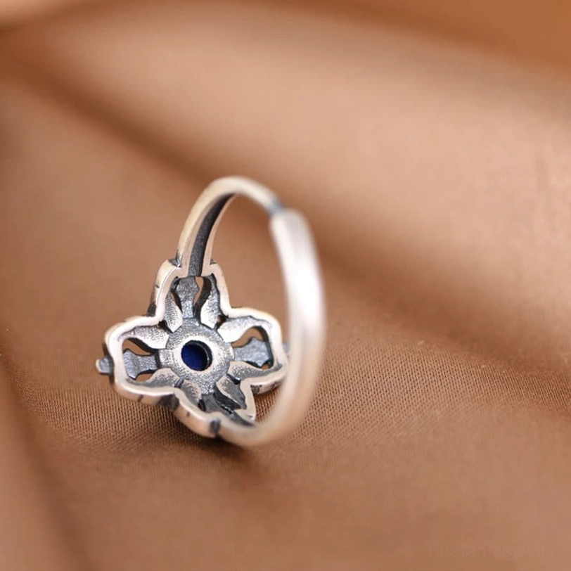 Back of lapis lazuli ring showing hollow carved silver back and adjustable open band structure