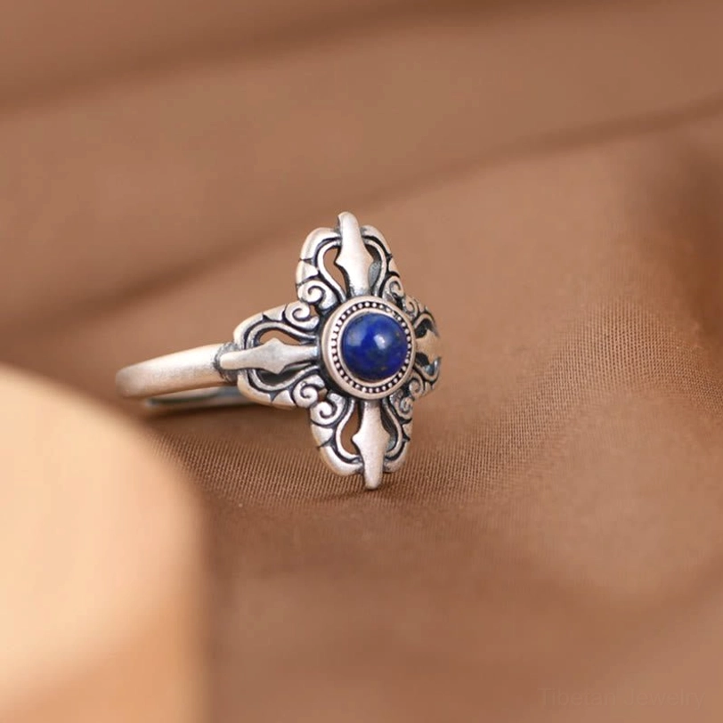 Lapis lazuli silver ring left side profile with intricate floral carved silver patterns