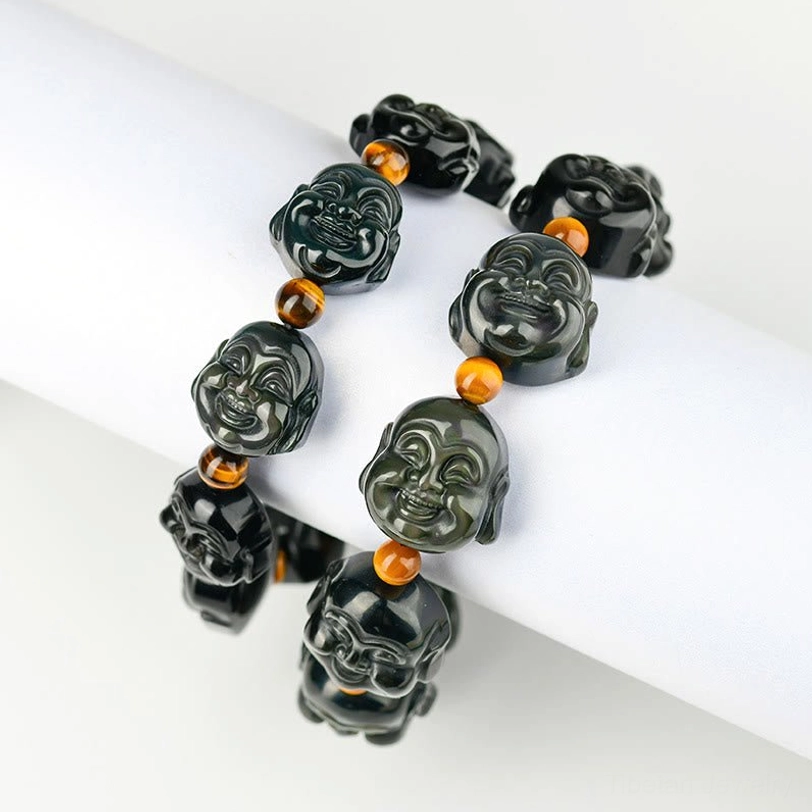 Laughing Buddha bracelet with tiger eye spacers - complete jewelry showing protective energy combination of obsidian and tiger eye stones