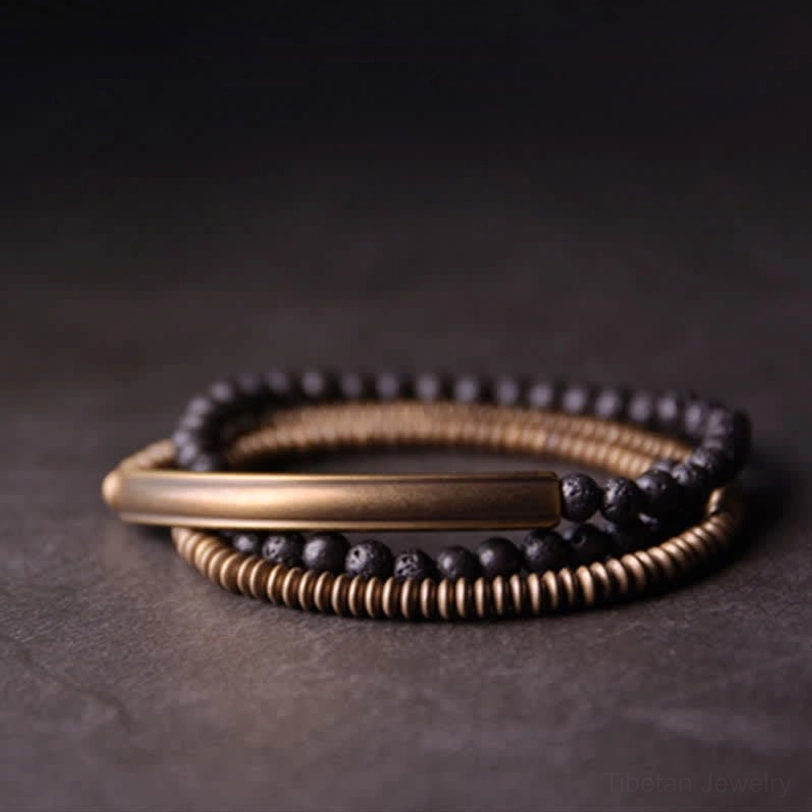 Multi-strand vintage lava rock and copper bracelet set flat lay showing handcrafted artisan details