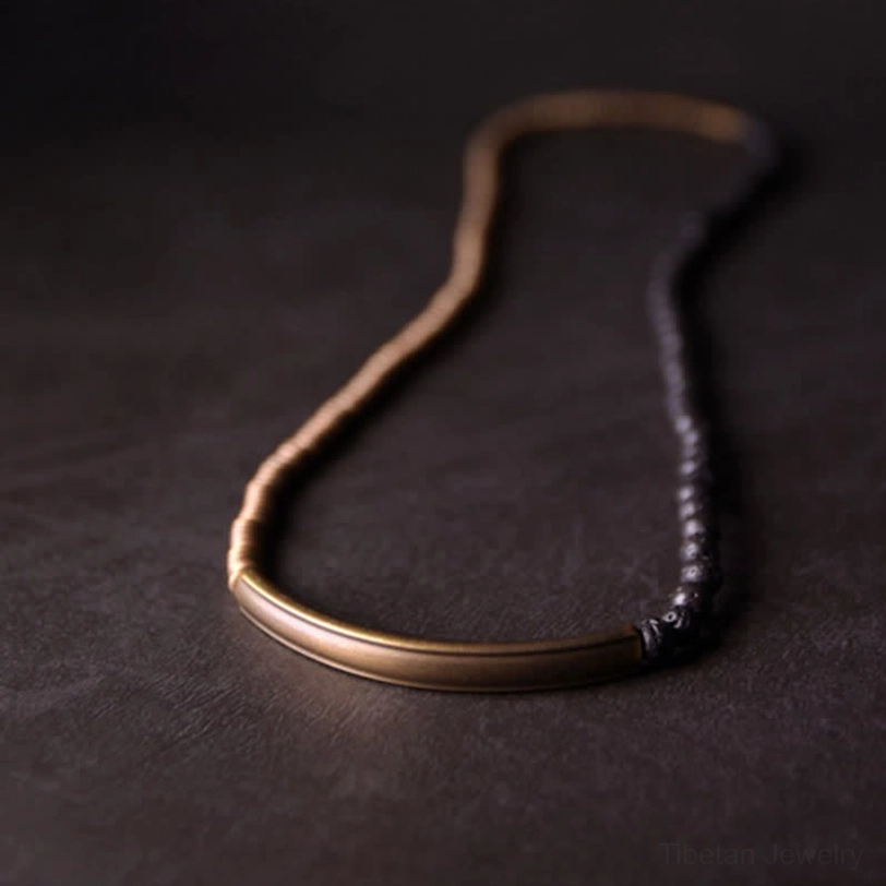 Layered lava rock bead and antiqued copper coil strand combination showing healing bracelet versatility