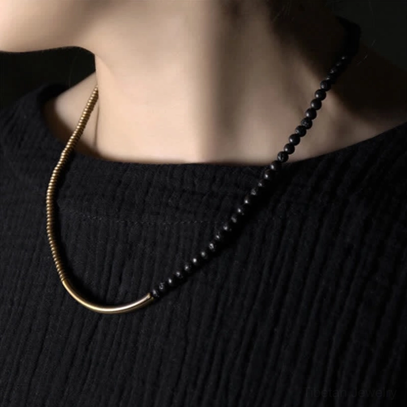 Black lava rock bead chain with antiqued copper accent styled as grounding spiritual jewelry