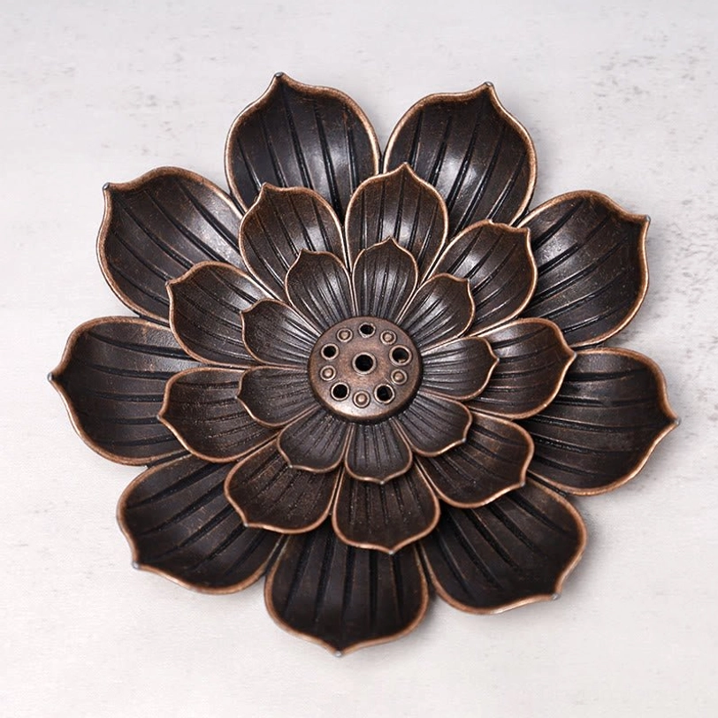 Six-hole lotus-shaped bronze incense burner holder for Tibetan meditation practice, symbolizing spiritual enlightenment and rebirth