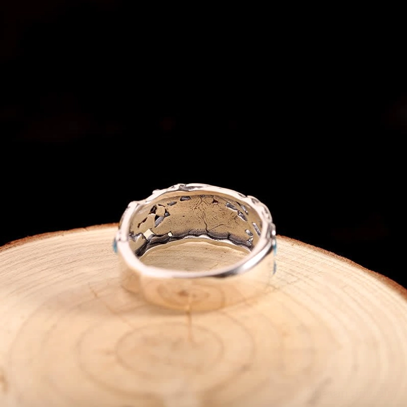 Back view of lotus koi fish silver ring displaying inner band carved details and craftsmanship