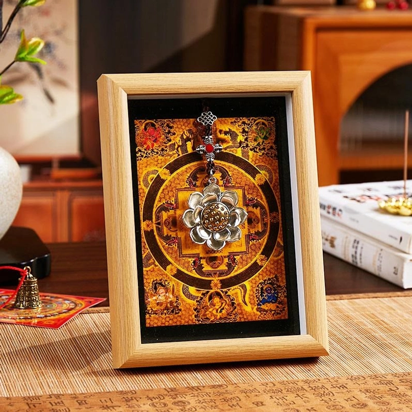 Lotus mandala thangka frame with light natural wood and warm orange-golden mandala artwork, spiritual home decor with silver lotus pendant
