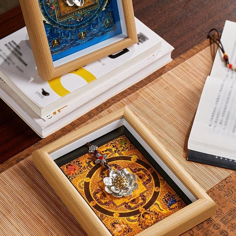 Lotus golden ingot thangka mandala frame close-up detail showing silver lotus pendant with gemstone inlays and handcrafted frame finish