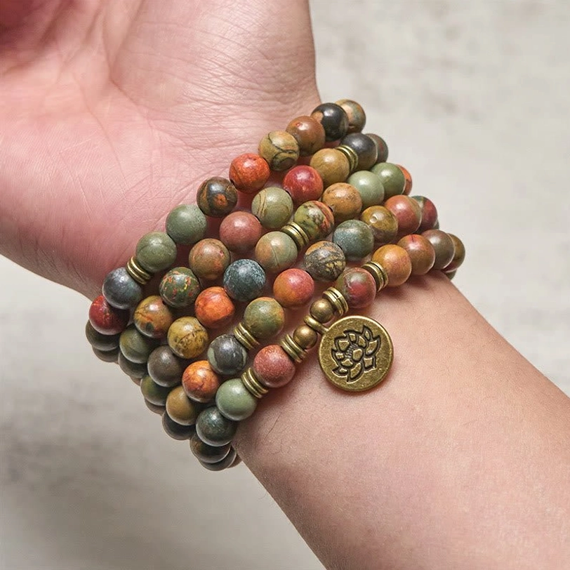 Tibetan mala bracelet worn on wrist showing how to wear lotus charm bracelet for daily meditation practice