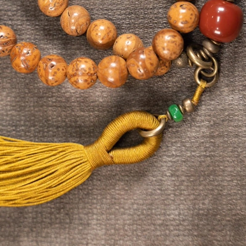 Bodhi mala bracelet tassel clasp and metal hardware with red and green accent beads