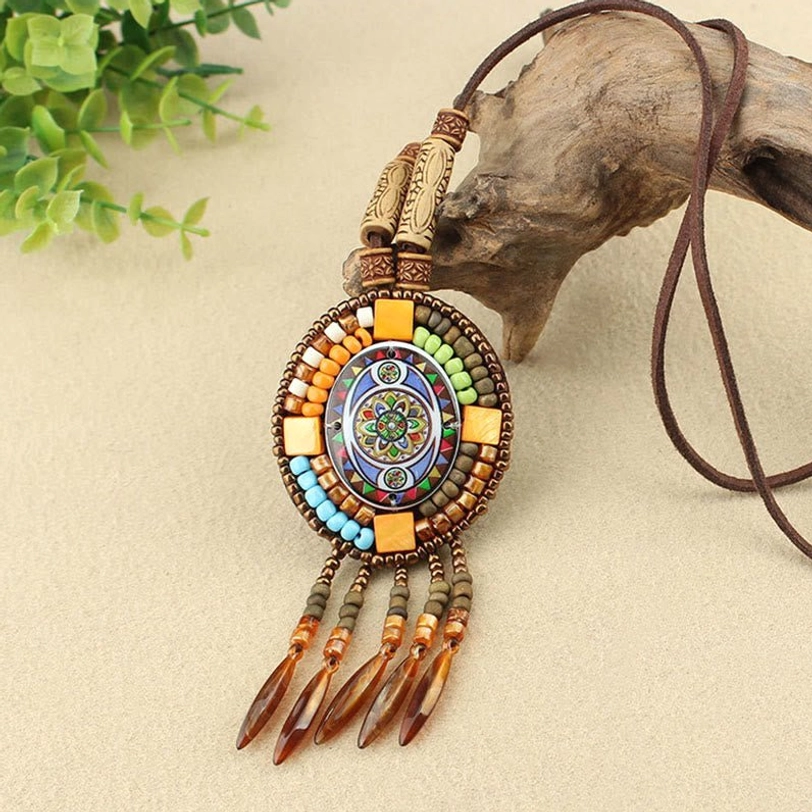 Hand-painted mandala necklace pendant with yellow geometric border and brown leather cord tassel