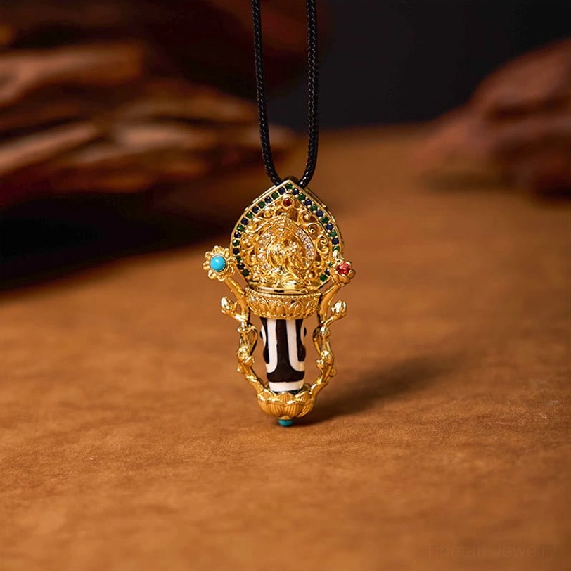 Manjusri Tibetan motif Dzi bead pendant with gilded statue and gemstone inlays, three-quarter angle shot