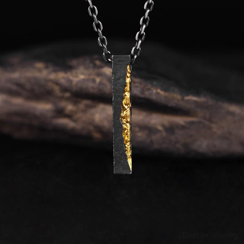 Handcrafted Tibetan mantra bar pendant with textured surface and chain