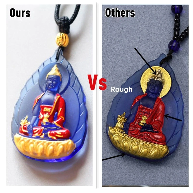 Blue Gold Medicine Buddha Liuli pendant with amber-yellow to blue gradient glass frame, Buddha figure with swastika sacred symbol, gold accents, and red braided cord