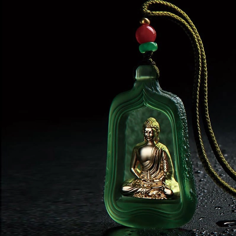 Green frosted Medicine Buddha crystal pendant showing detailed craftsmanship with golden Buddha and beaded braided cord